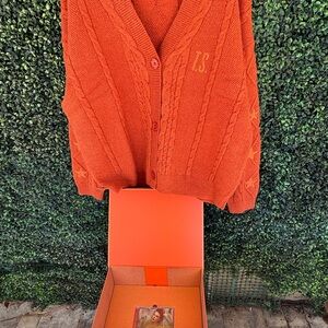 Taylor Swift THE LIFE OF A SHOWGIRL cardigan and CD box set.